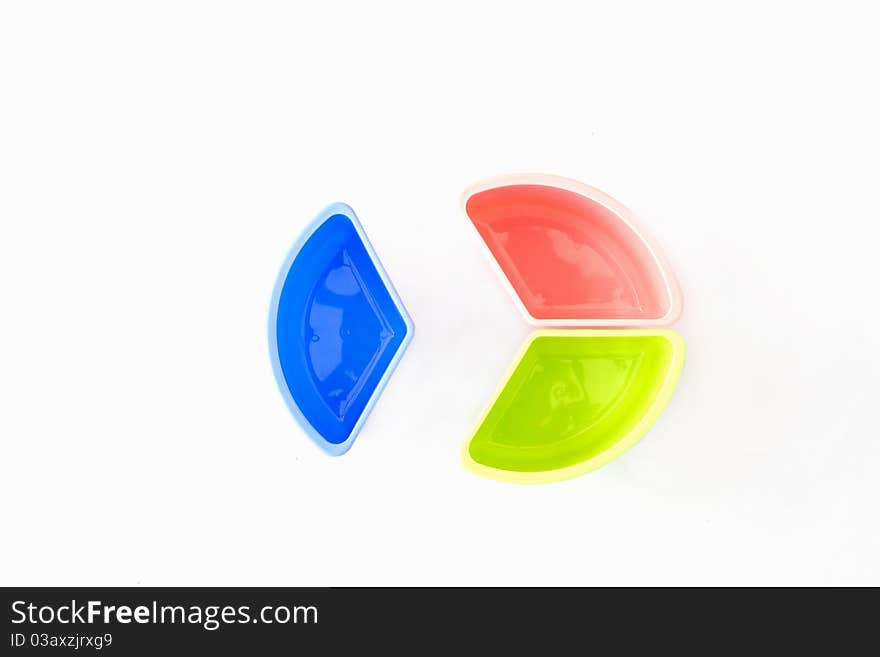 Multi-coloured disposable plastic isolated on white background