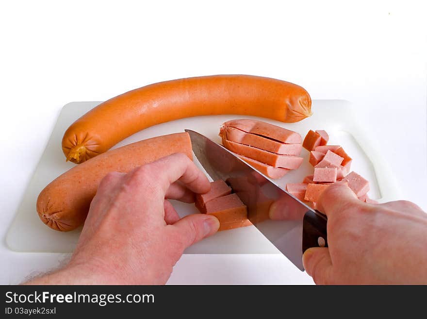 Photo from sausage, and how to cut it into pieces. Photo from sausage, and how to cut it into pieces.