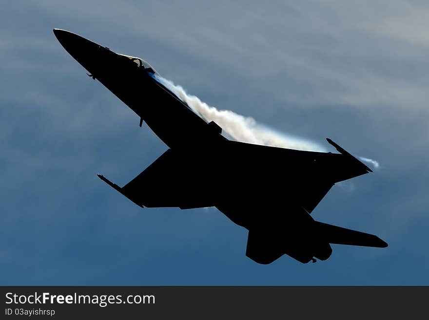 F18 fighter jet performing a high G's pull up