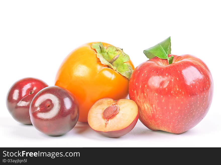 Plums, Persimmon And Red Apple