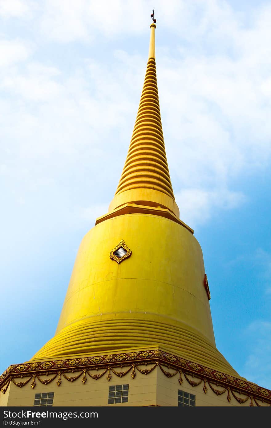 Holy Thai golden pagoda with blue sky