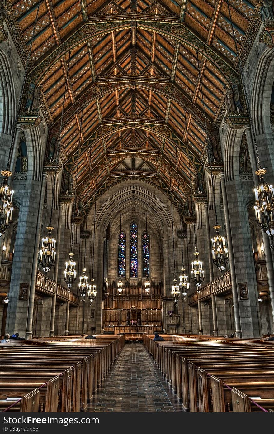 Image of church interior with few prayers.