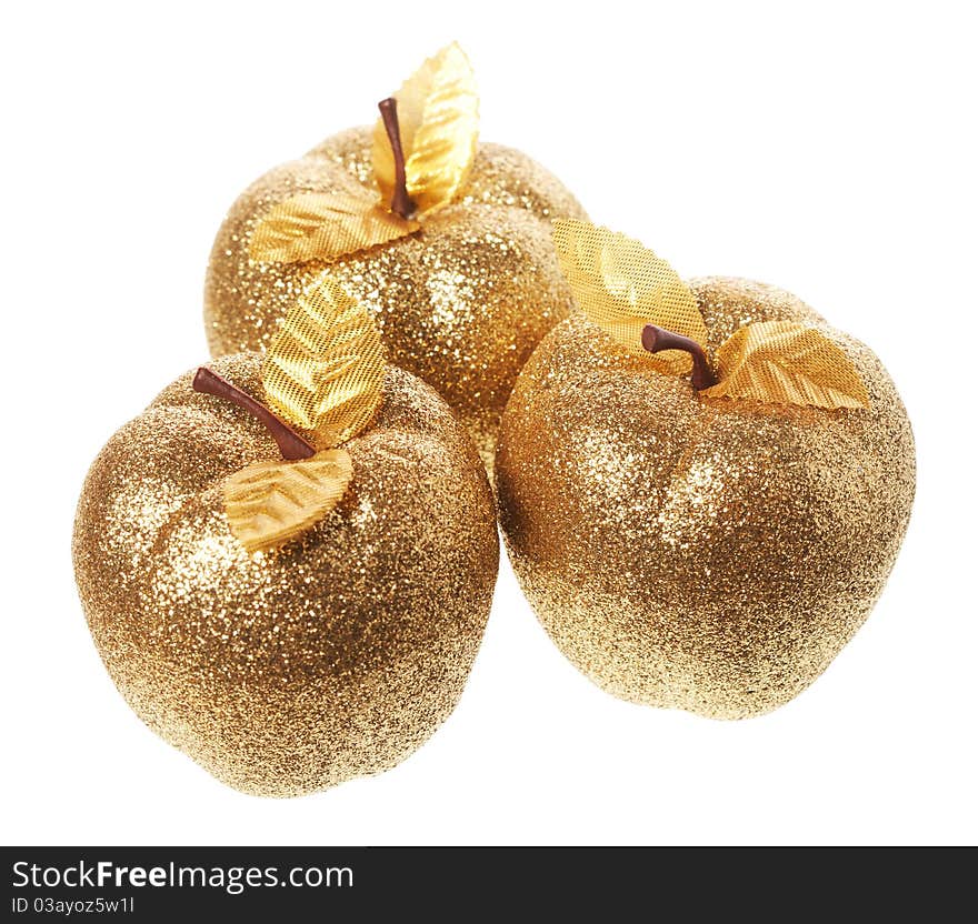 Golden apple lying on a white background