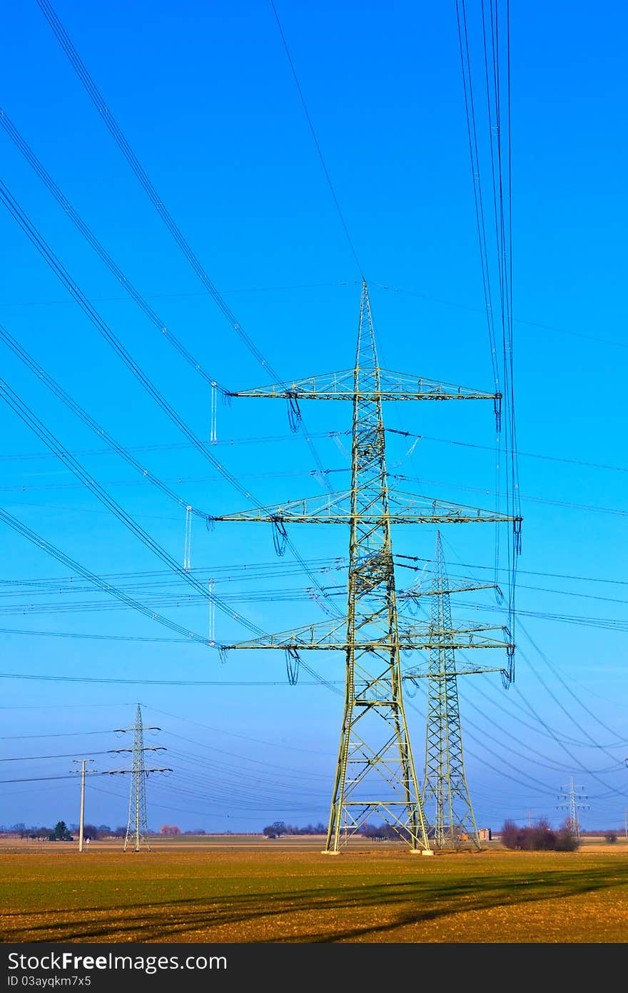 High voltage tower on a background with sky