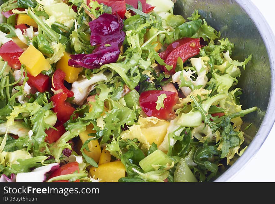 Salad with fresh lettuce leaves, tomatoes, red and yellow pepper, cucumber. Salad with fresh lettuce leaves, tomatoes, red and yellow pepper, cucumber