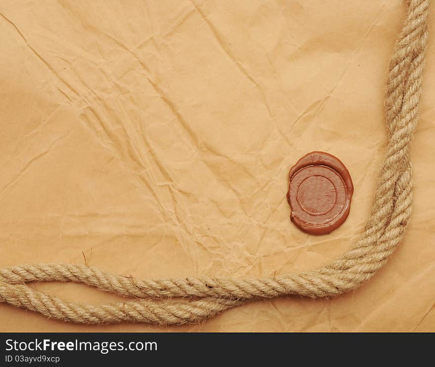 Seal wax and rope on old paper background