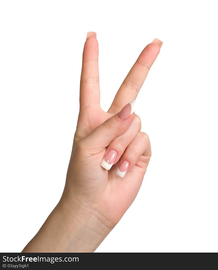 Women's hand shows the gesture of victory is isolated on a white background. Women's hand shows the gesture of victory is isolated on a white background.