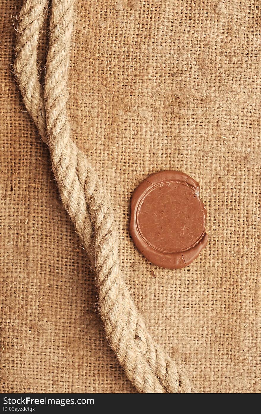 Wax seal and rope on sackcloth material