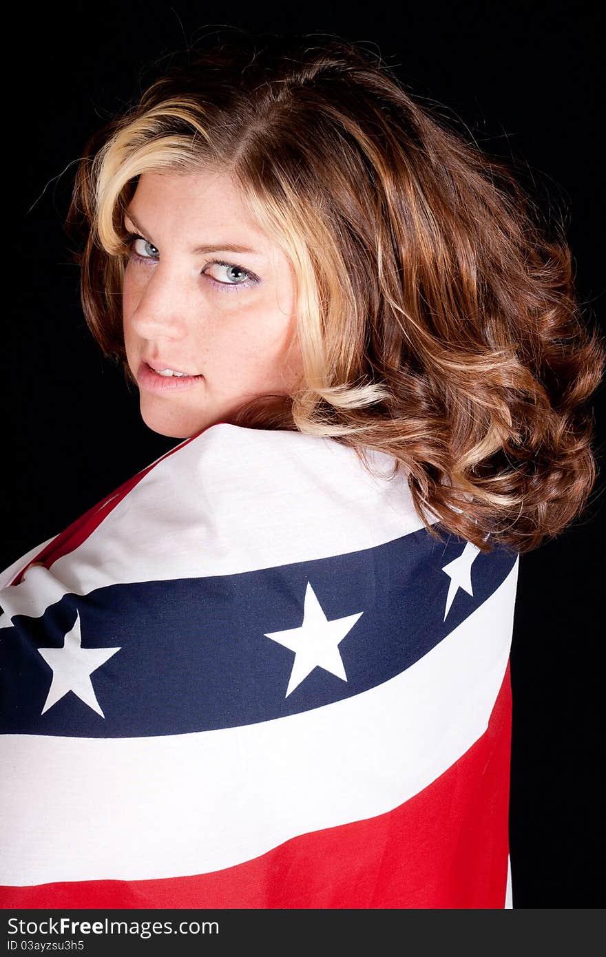 A American woman wrapped in patriotism. A American woman wrapped in patriotism.