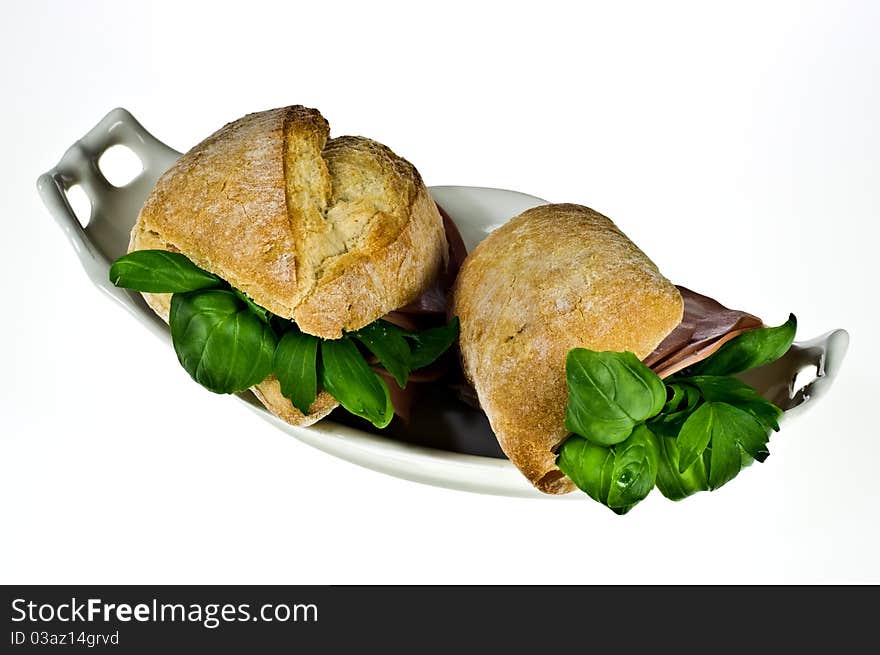 Ciabatta bread rolls with mortadella and basil