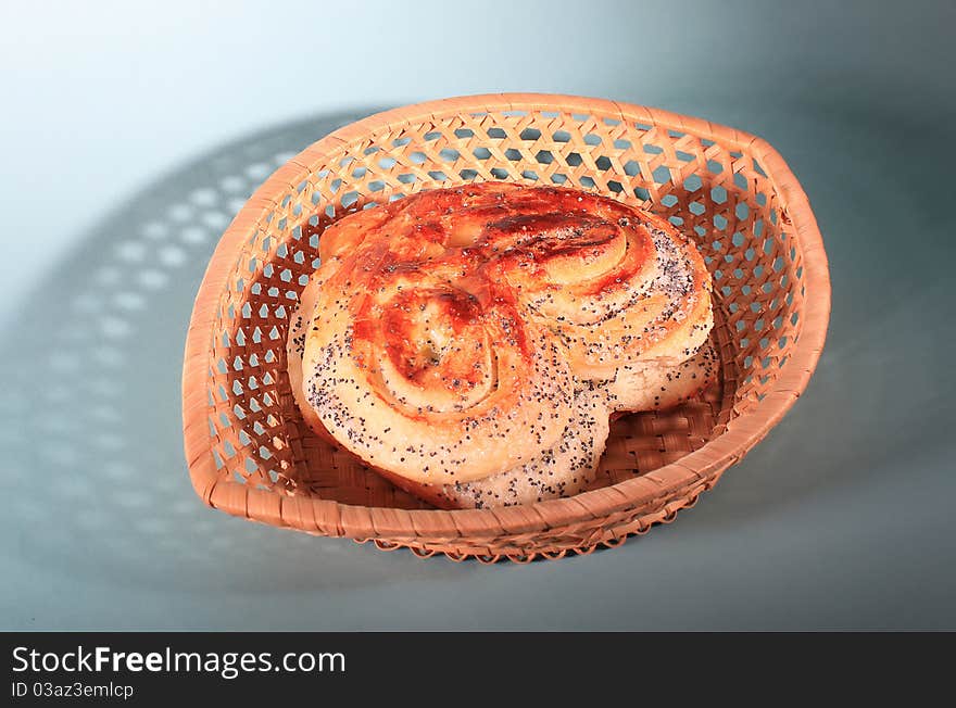 Sweet heart bread with poppie seeds in a basket.