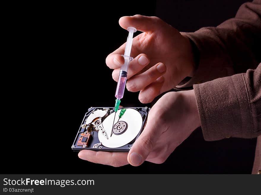 Conceptual photo of repairing hard disc with surgical needle. Conceptual photo of repairing hard disc with surgical needle.