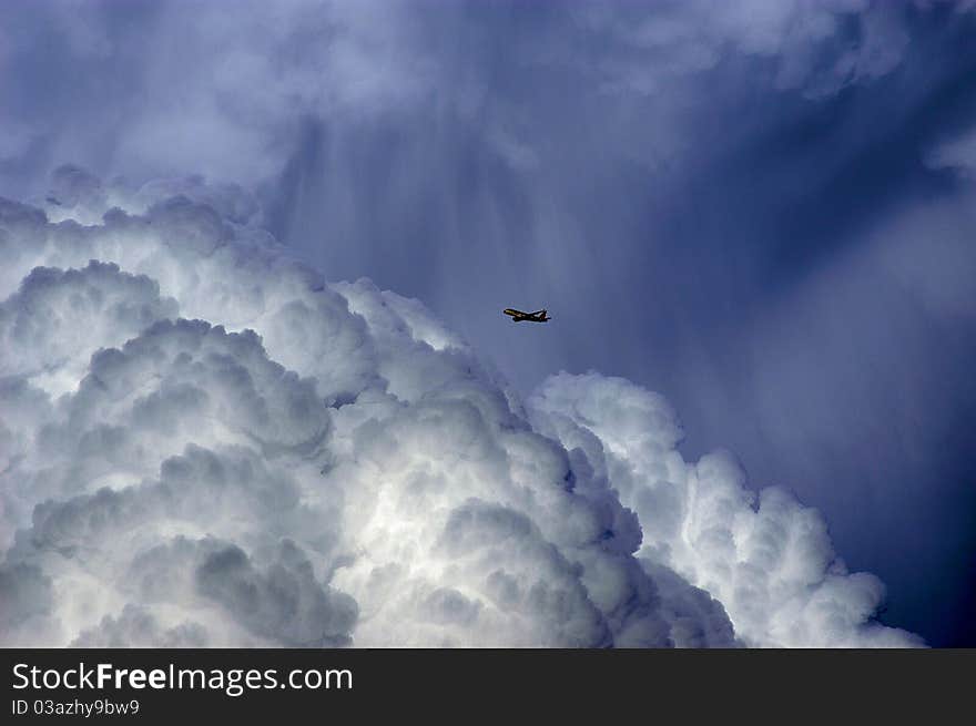 Aircraft flying near thunderstorm clouds. Aircraft flying near thunderstorm clouds