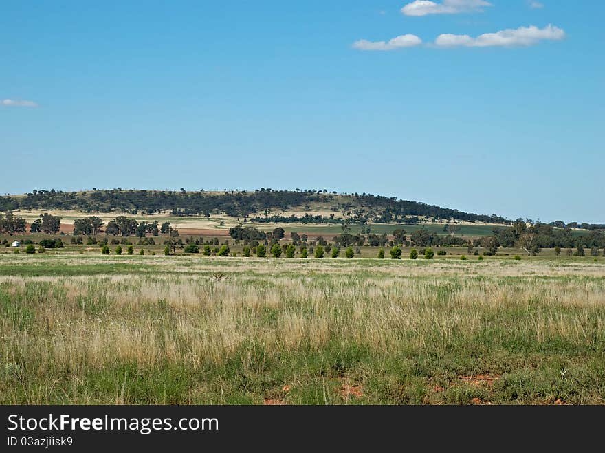 Farm land at the foot of a hill. Farm land at the foot of a hill