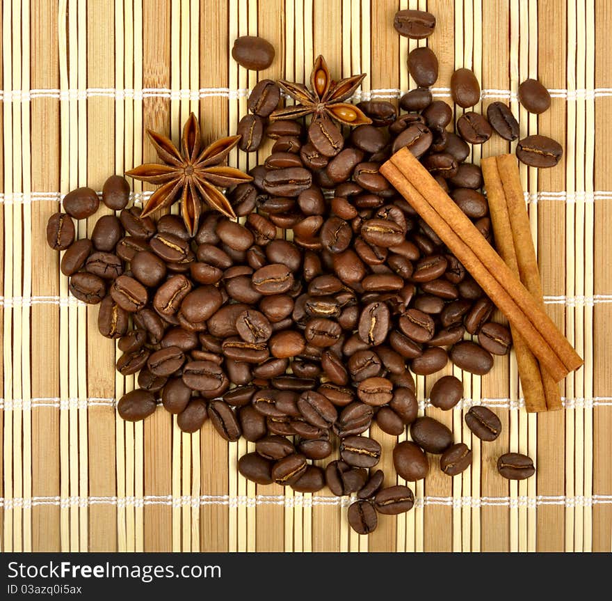 Coffee and spices on a wooden mat