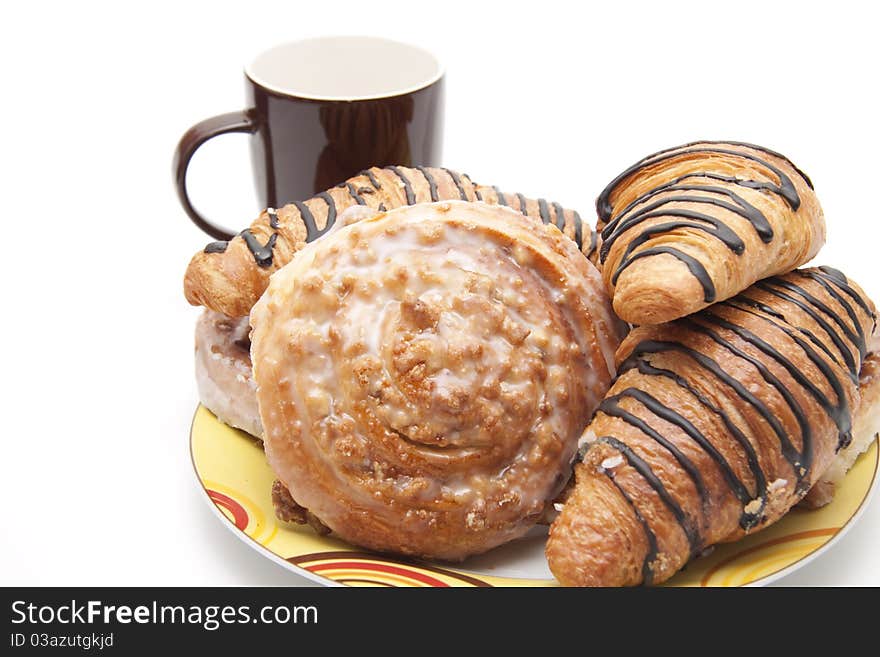 Pastry onto plates with coffee cup