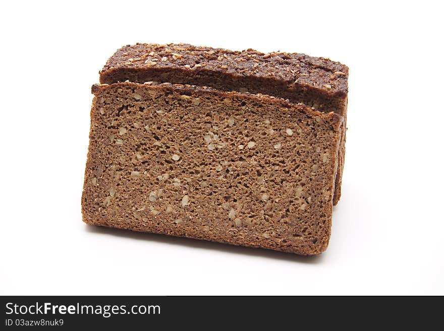 Wholemeal bread cut onto white background