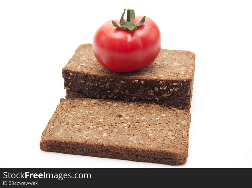 Tomato on wholemeal bread with white background