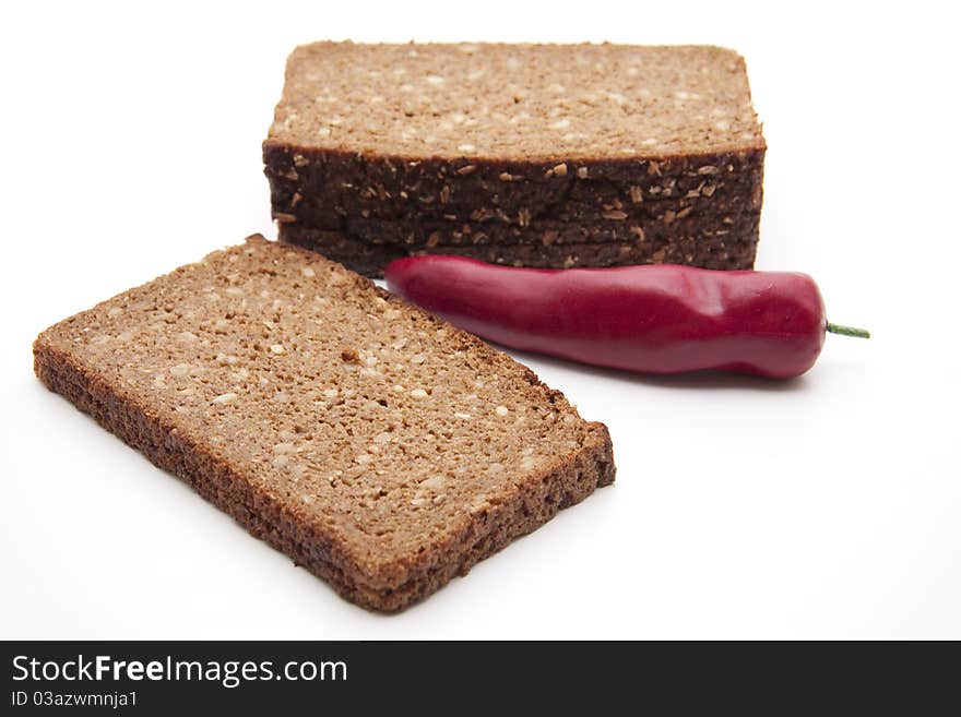 Chilli and wholemeal bread with white background. Chilli and wholemeal bread with white background