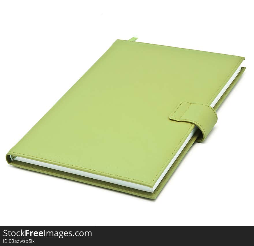 Green book on white background