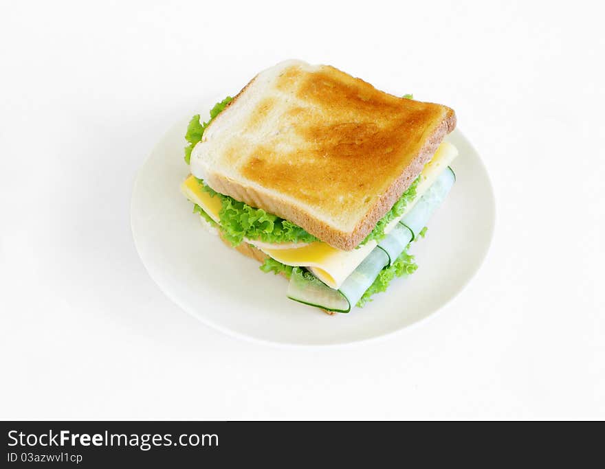 Sandwich with cheese, lettuce,bread and cucumber