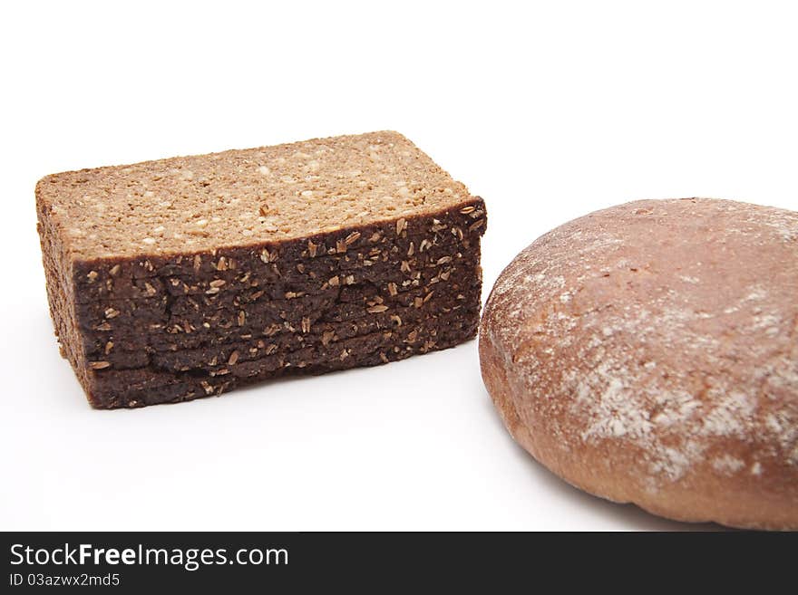 Wholemeal bread and wheat bread onto white background