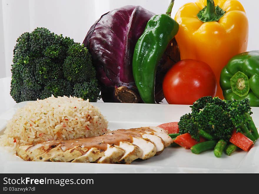 Fresh vegetable with tasty rice and fish in a plate. Fresh vegetable with tasty rice and fish in a plate.