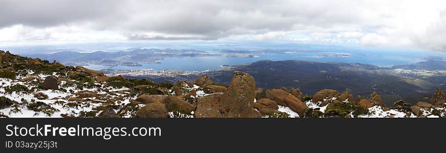 Panorama of Mount Wellington, Tasmania, with snow. The view below is of Hobart, the capital city. Panorama of Mount Wellington, Tasmania, with snow. The view below is of Hobart, the capital city.