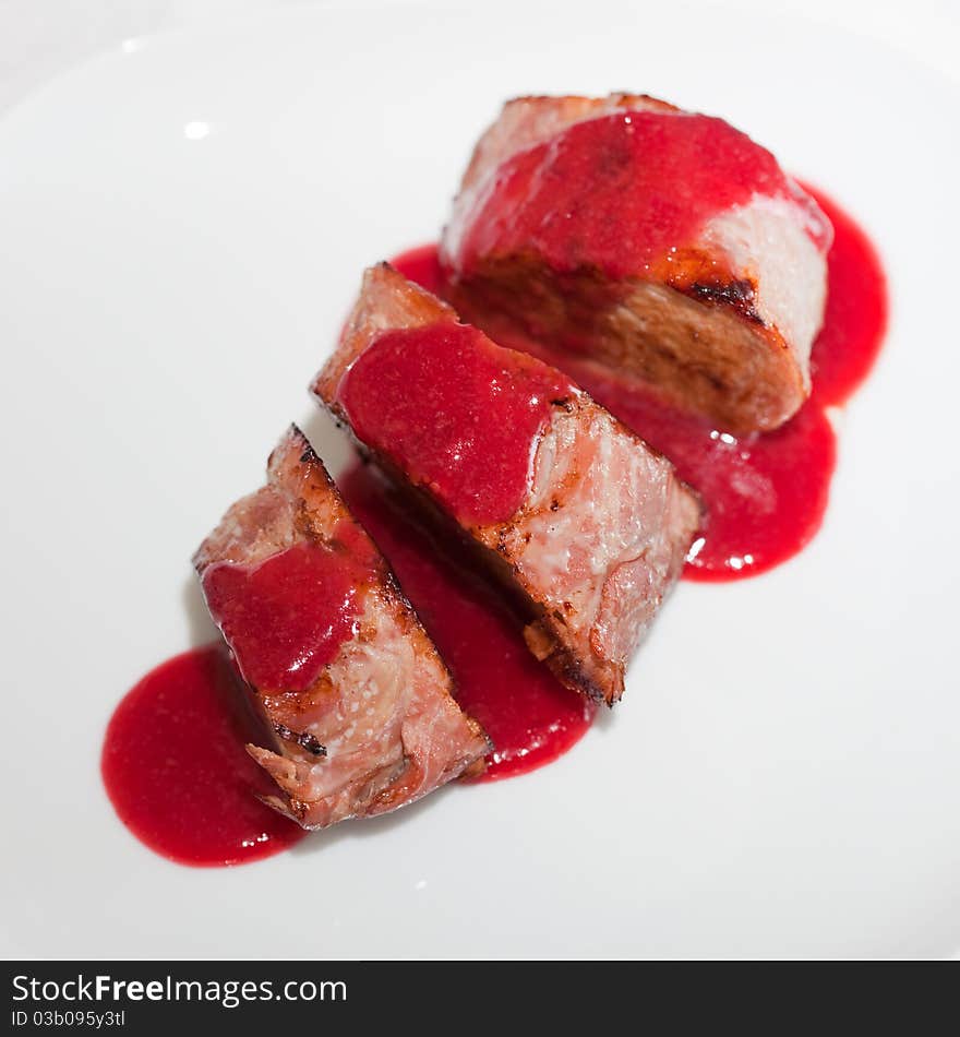 Dish from a pork cutting in sweet cherry sauce