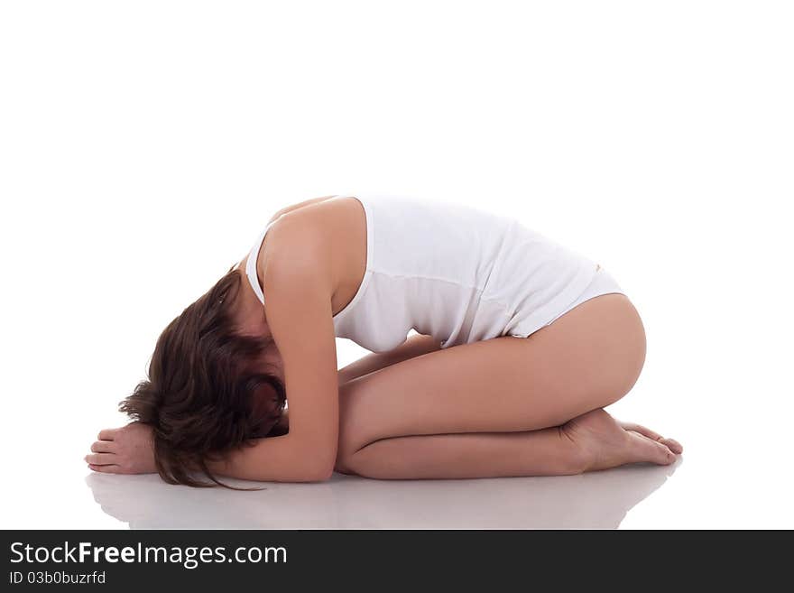 Fit woman in white underwear practicing yoga over white. Fit woman in white underwear practicing yoga over white