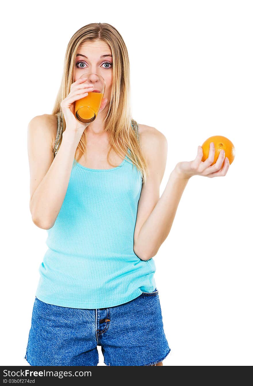 Lovely girl with orange drinking fresh juice, white background. Lovely girl with orange drinking fresh juice, white background