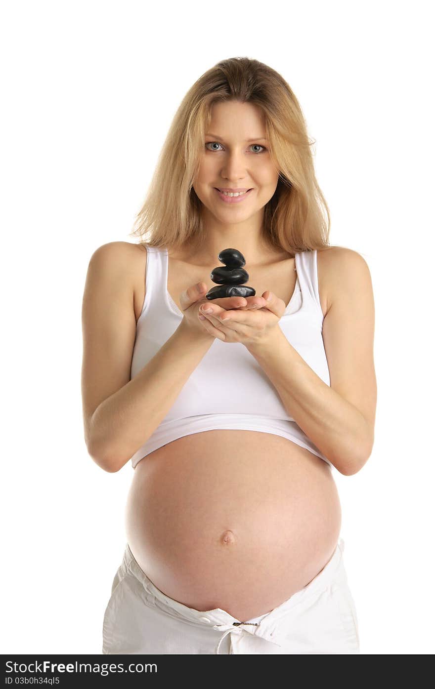 Pregnant woman with stones isolated on white