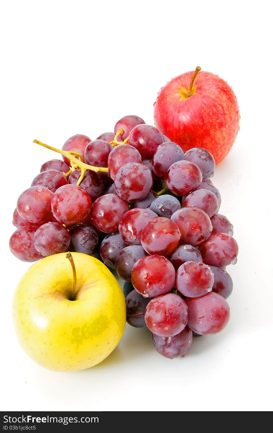 Grapes and apple on white background