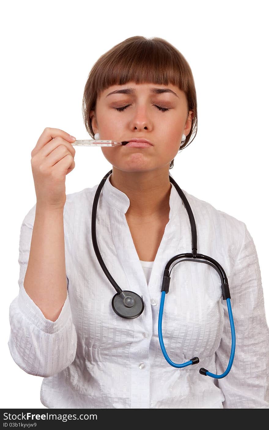 Beautiful young woman doctor with a thermometer isolated on white background