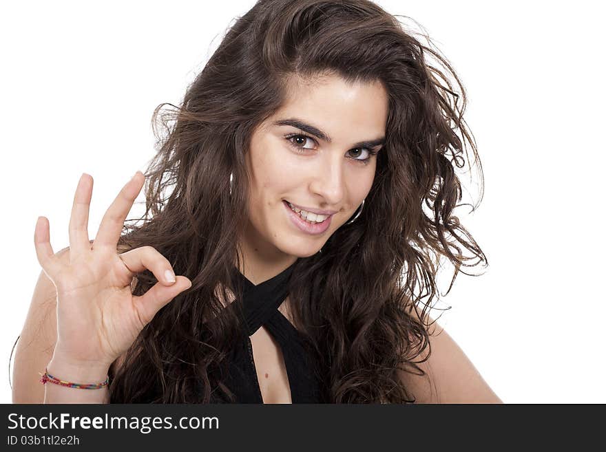 Beautiful woman with long and curly hair making ok sign. Beautiful woman with long and curly hair making ok sign