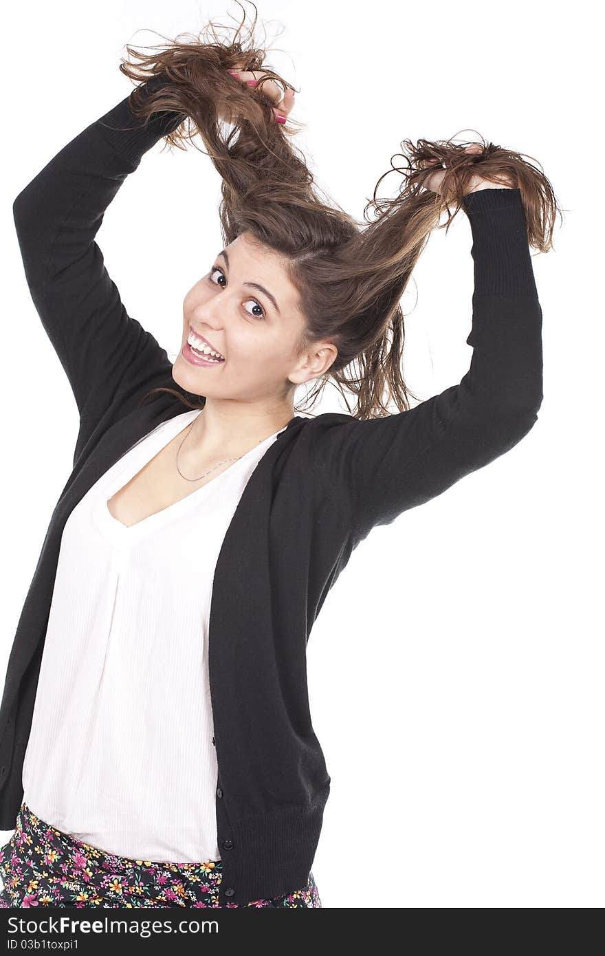 Young girl having fun and pulling her long hair