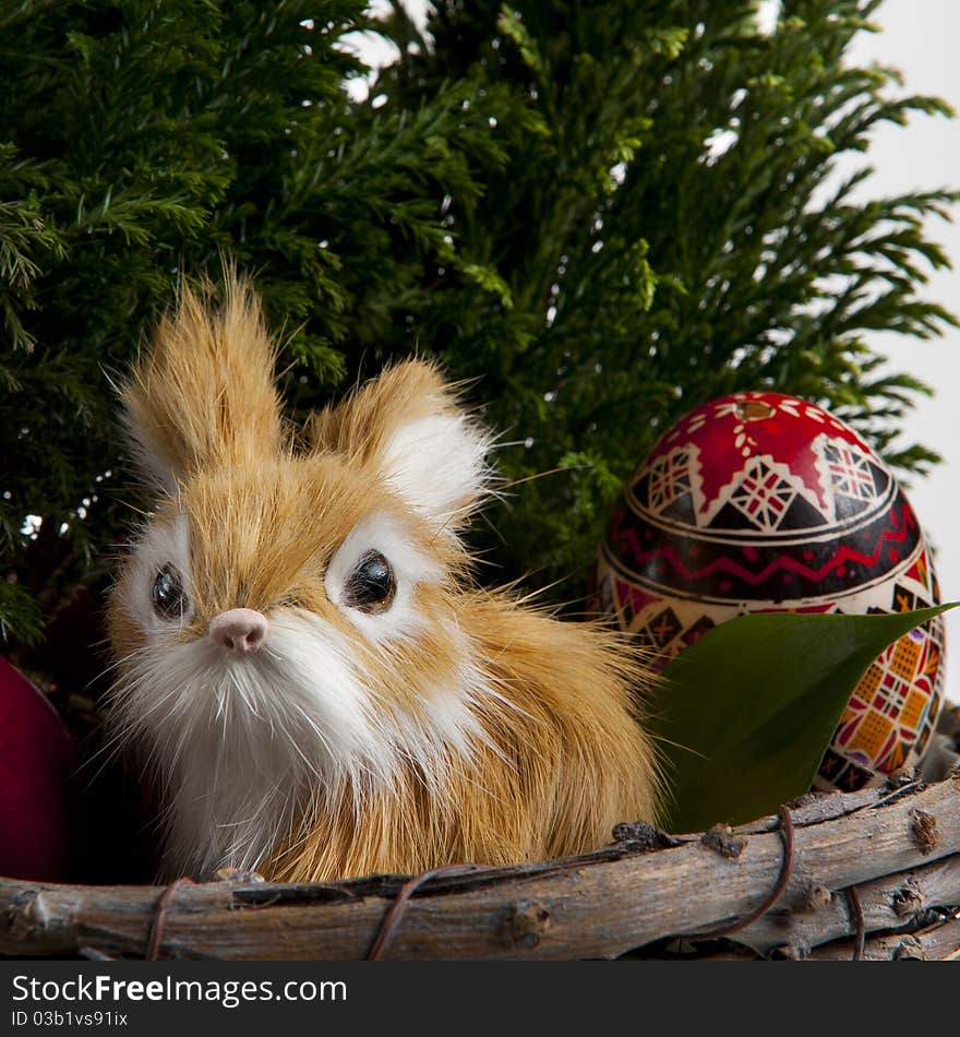 Easter bunny with traditional painted eggs