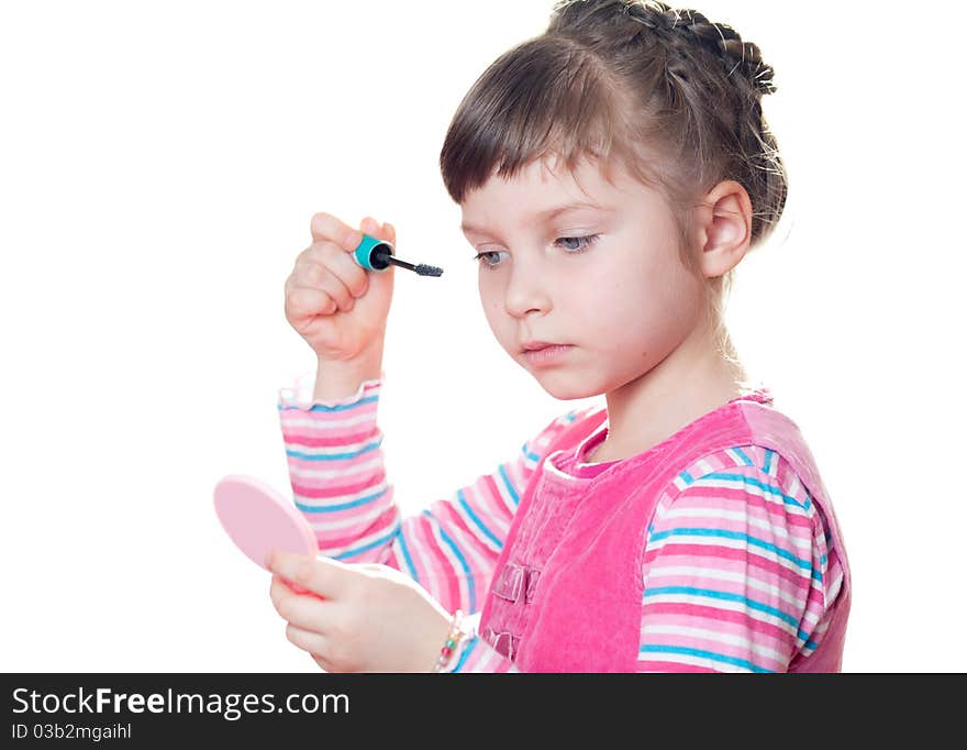 Young girl applies mascara. Isolated on a white background. Young girl applies mascara. Isolated on a white background.