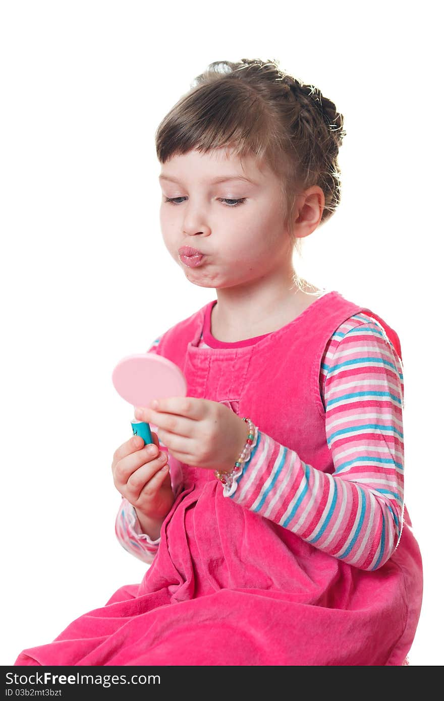 Young girl applies lipstick. Isolated on a white background. Young girl applies lipstick. Isolated on a white background.