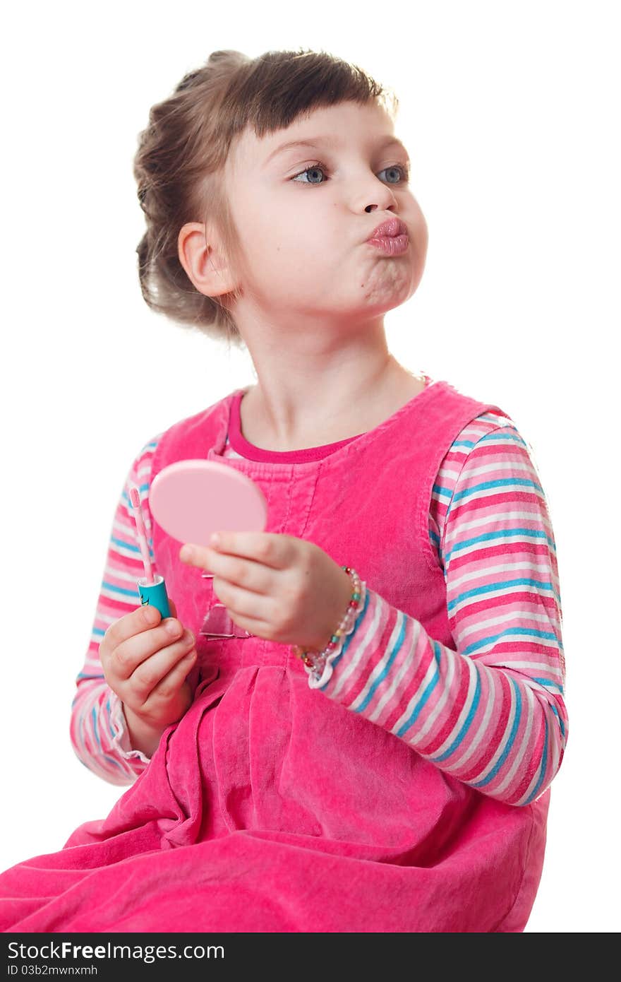 Young girl applies lipstick. Isolated on a white background. Young girl applies lipstick. Isolated on a white background.