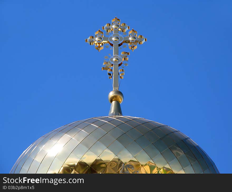 Gilded dome orthodox church on background blue sky