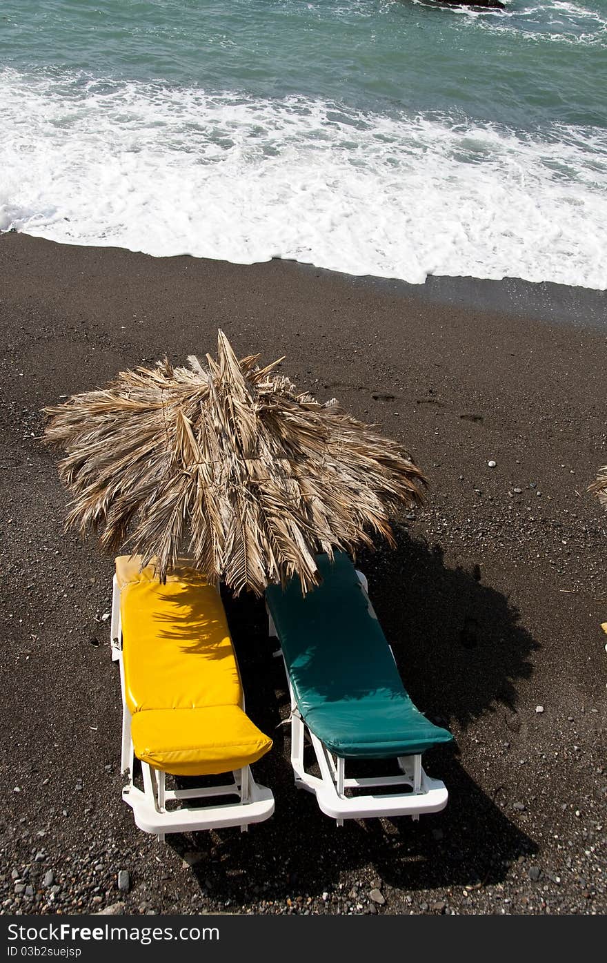 Sun Bed On A Black Beach