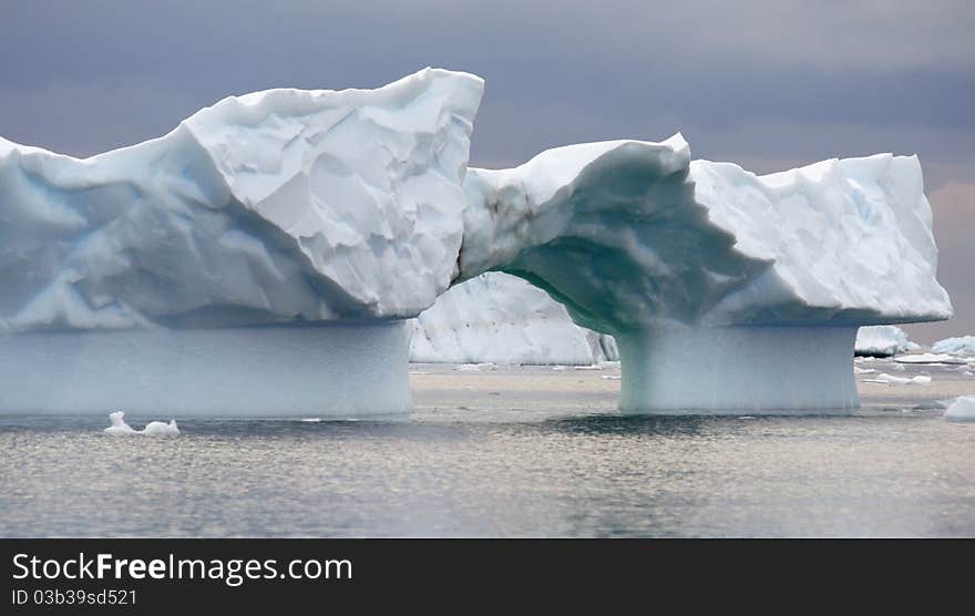 Arch iceberg in Antarctica ocean