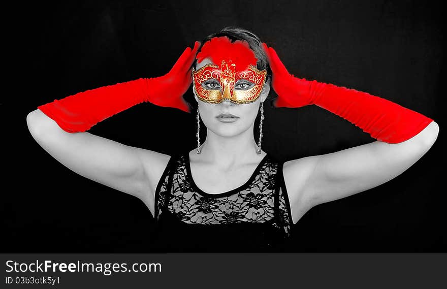 Portrait of beautiful young woman wearing red italian glowes and mask. Portrait of beautiful young woman wearing red italian glowes and mask.