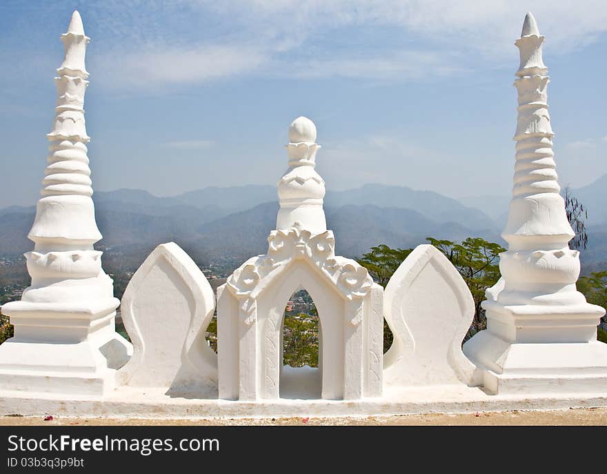 three tops of White pagoda with blue sky