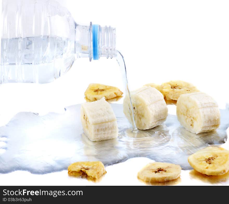 Dried bananas being rehydrated by water. Dried bananas being rehydrated by water