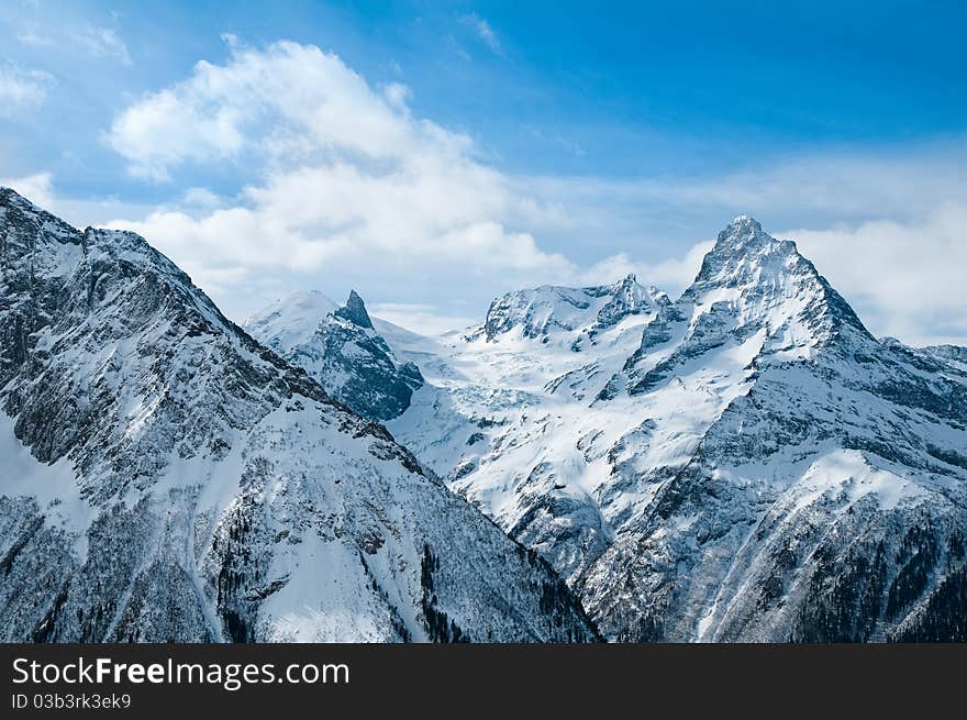 Snow-covered tops of the Caucasian mountains in Russia. Snow-covered tops of the Caucasian mountains in Russia.