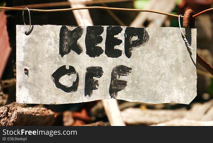 I saw this sign on an old wooden wagon dumped behind a tourist precinct. A lovely home-made message to Keep Off!. I saw this sign on an old wooden wagon dumped behind a tourist precinct. A lovely home-made message to Keep Off!