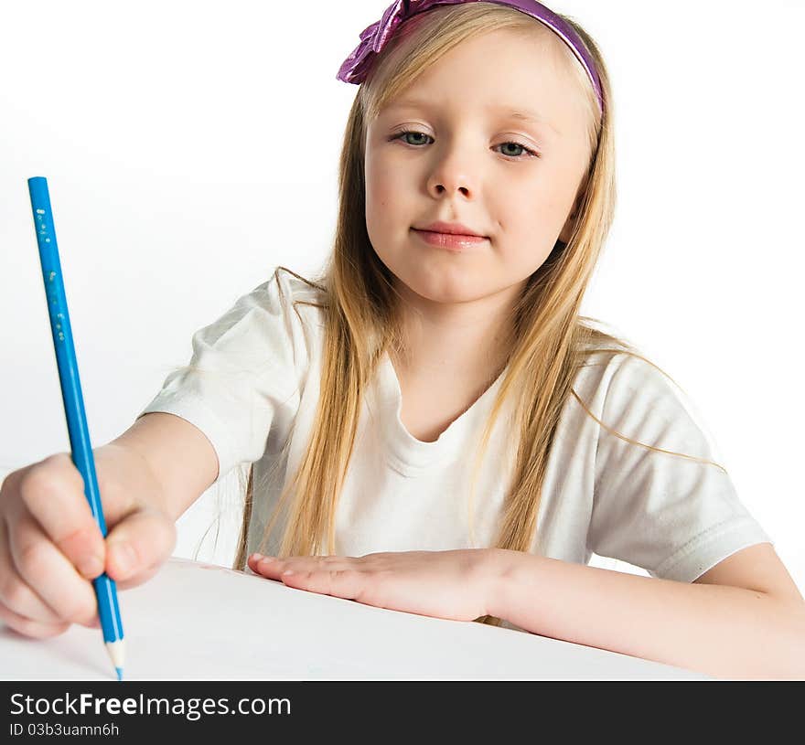 Adorable little girl drawing artwork. Studio shot