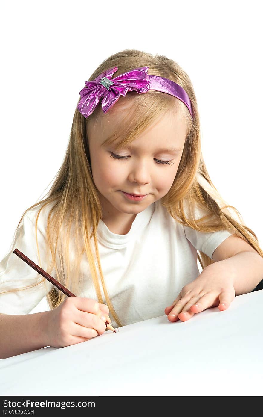 Adorable little girl drawing artwork. Studio shot